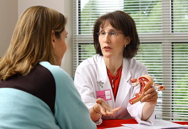 Dr. Handa speaks with patient