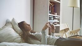 woman laying on bed 