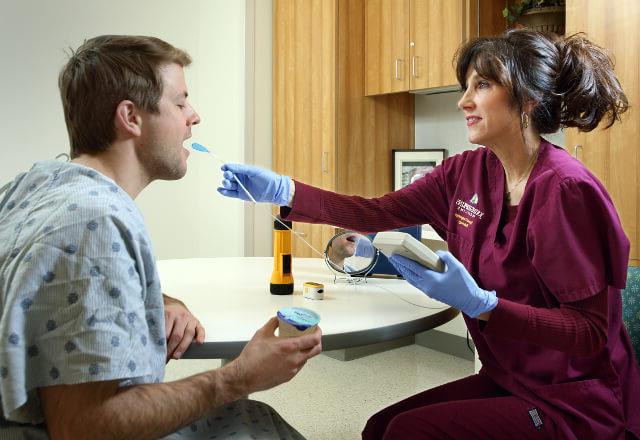 speech therapist working with a patient